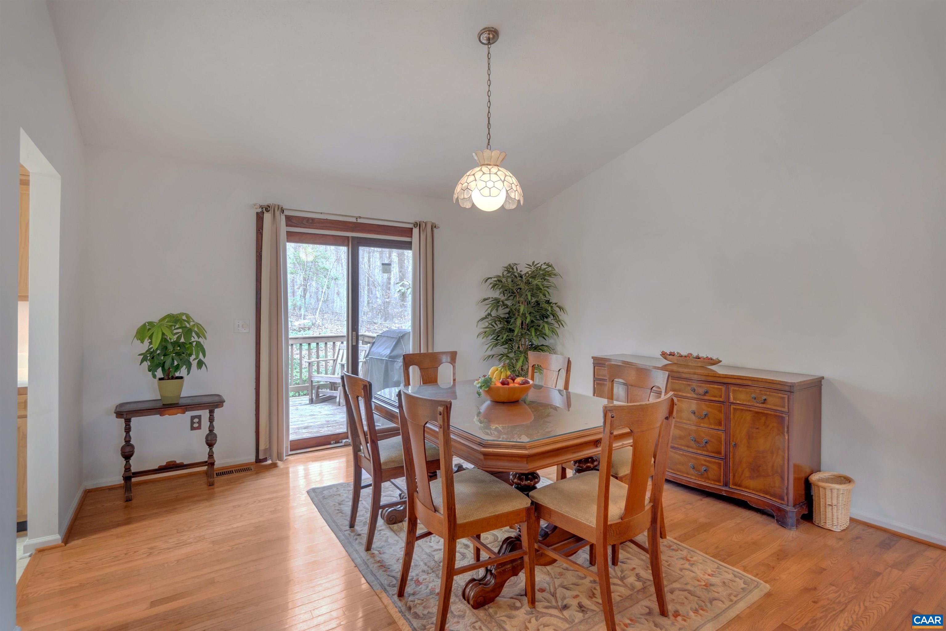 415 Rudolph Street Ruckersville, VA 22968 - Photo 18 of 38 a dining room with furniture potted plants and wooden floor