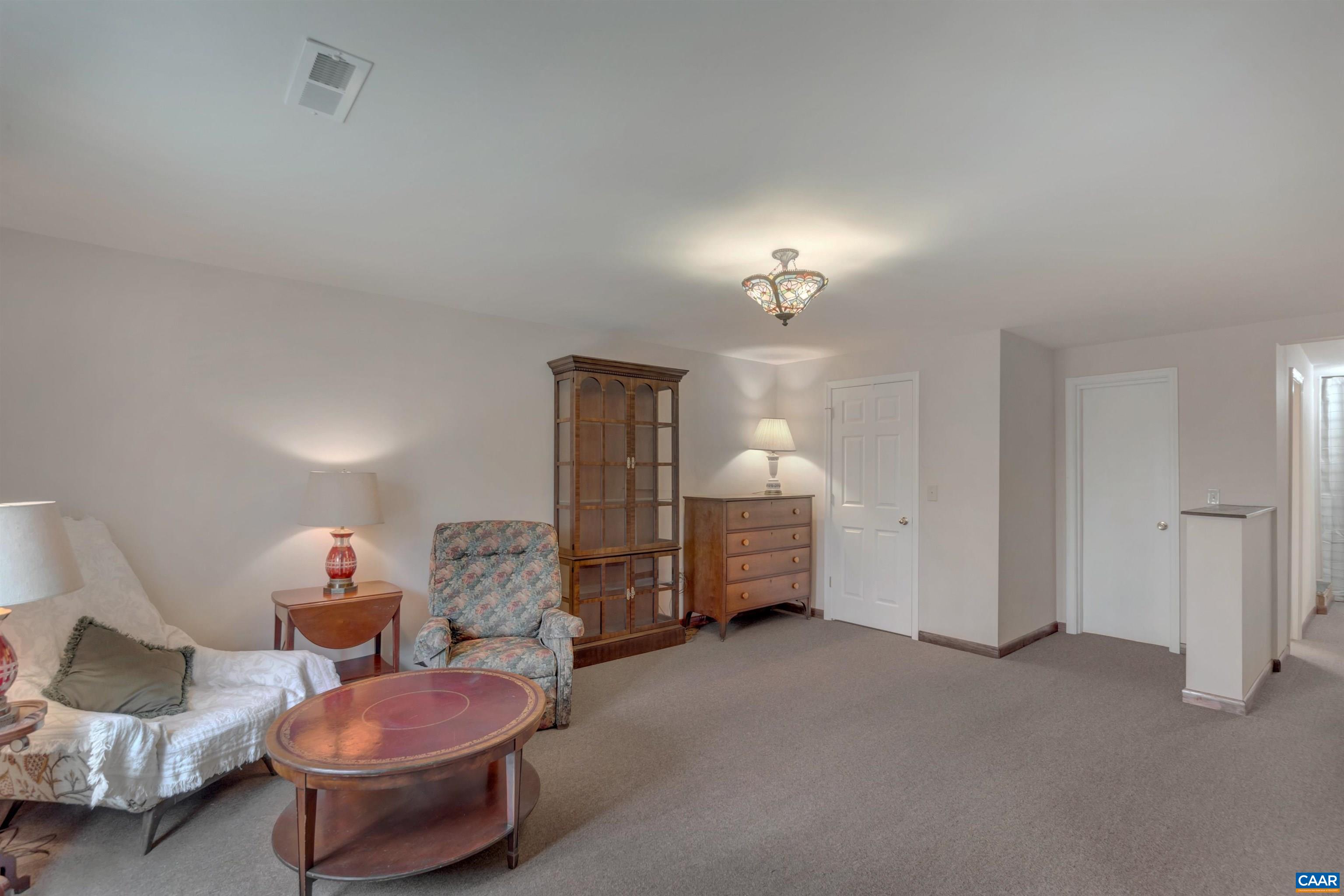 415 Rudolph Street Ruckersville, VA 22968 - Photo 25 of 38 a living room with furniture and a chandelier