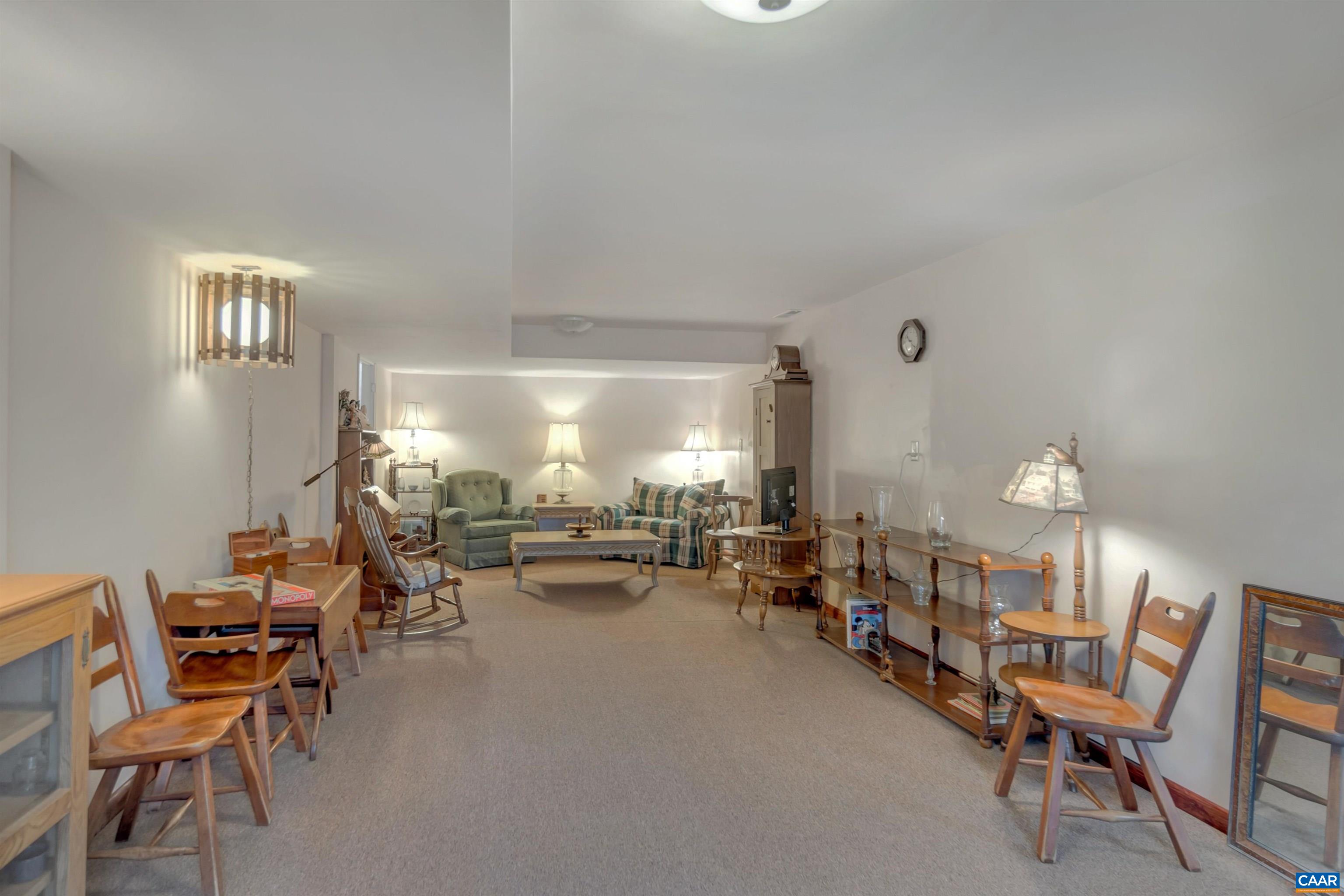 415 Rudolph Street Ruckersville, VA 22968 - Photo 28 of 38 a living room with furniture and a chandelier