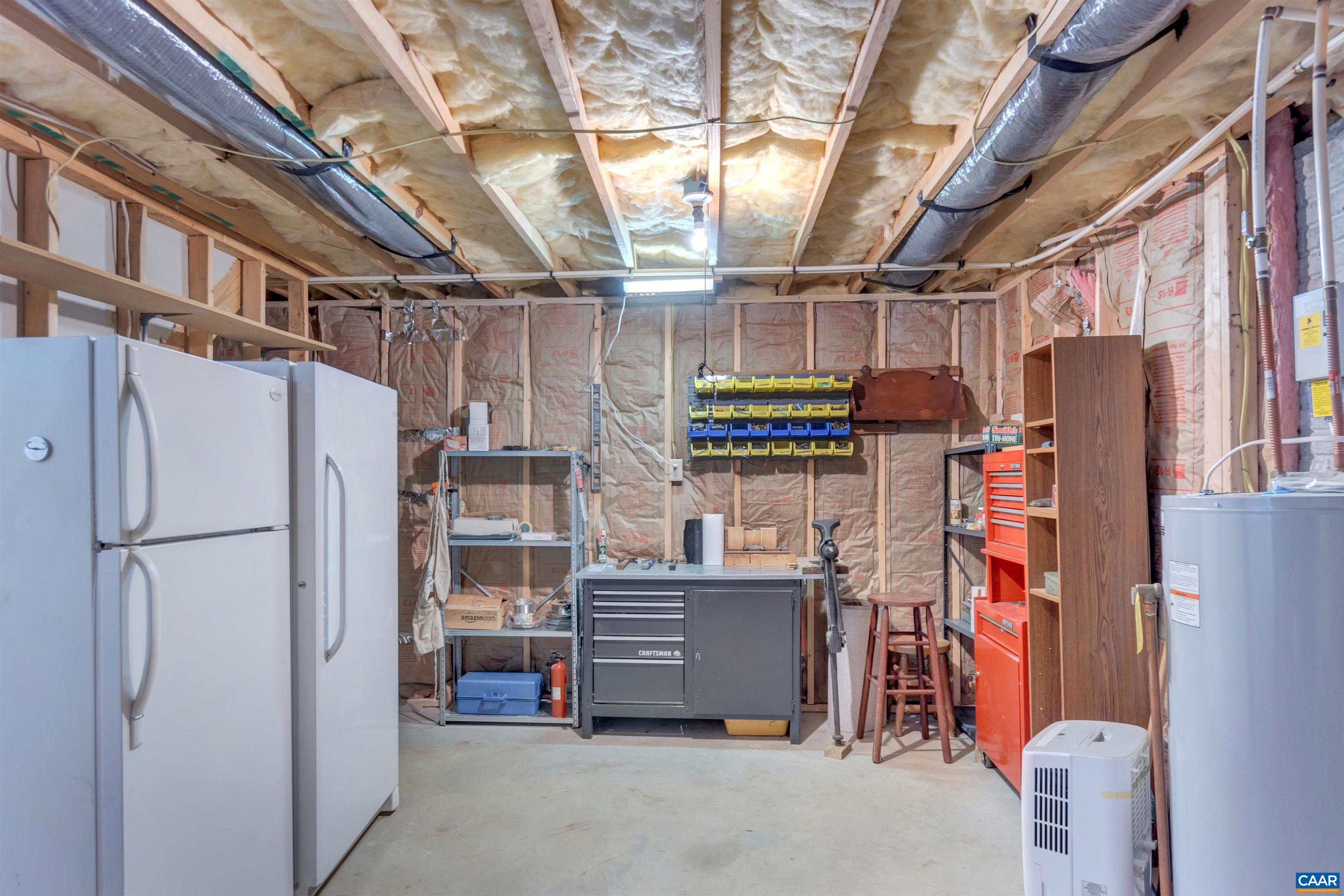 415 Rudolph Street Ruckersville, VA 22968 - Photo 30 of 38 a view of storage and utility room with a refrigerator