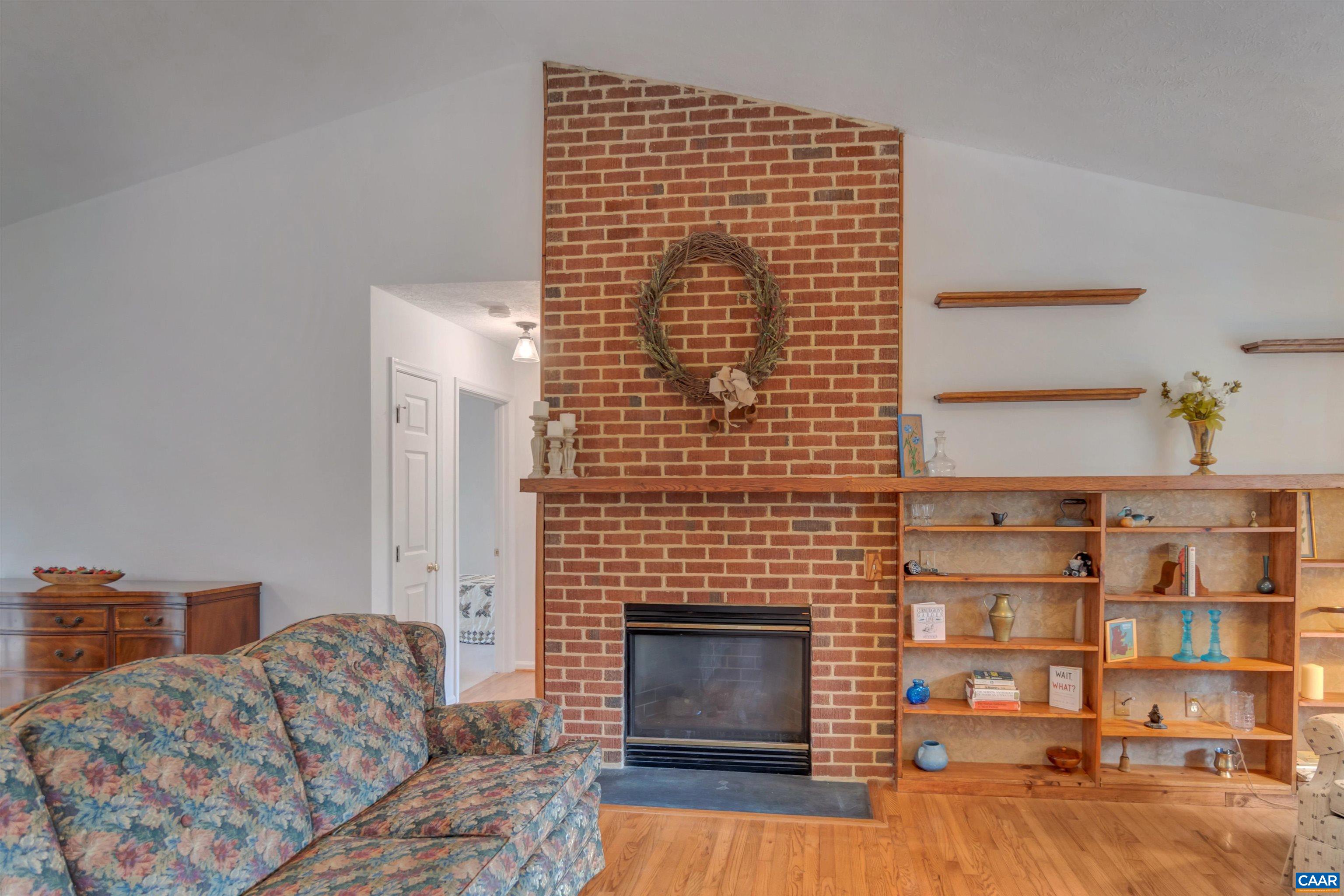 415 Rudolph Street Ruckersville, VA 22968 - Photo 10 of 38 a living room with furniture a fireplace and a rug