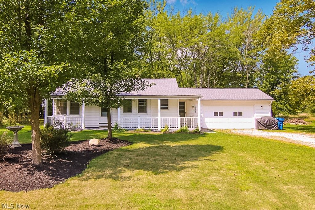 Come see the charm of this freshly updated ranch in a beautiful wooded setting.