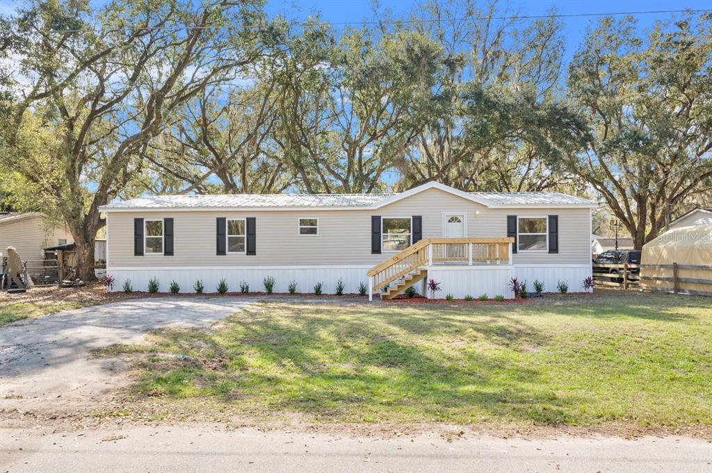 419 Garrett Ridge Court Winter Haven, FL 33880 - Photo 1 of 1 a view of a house with a yard