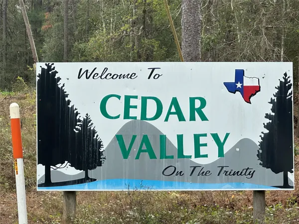 a view of outdoor space with signage and flags