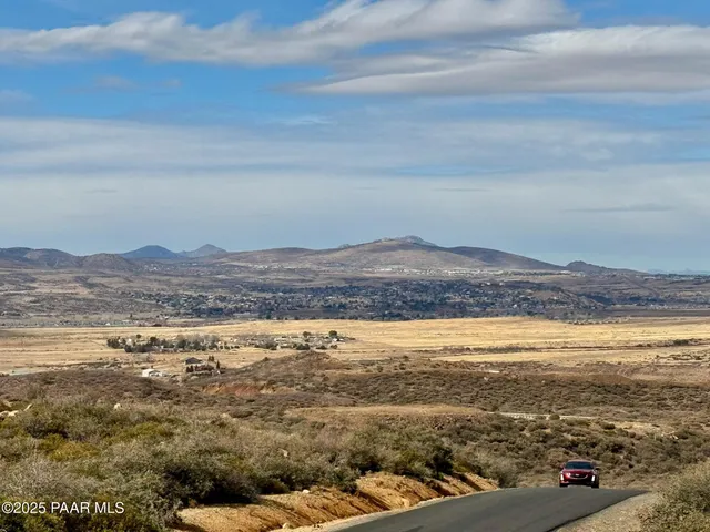 a view of ocean with a mountain