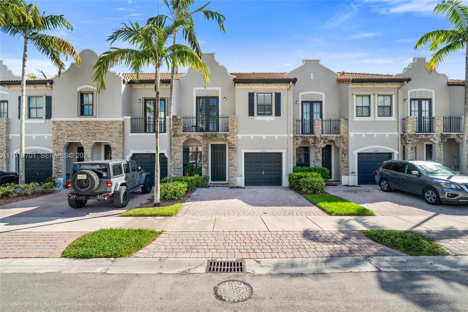 23713 Southwest 115th Avenue Homestead, FL 33032 - Photo 1 of 26 a view of a house with a patio and a yard