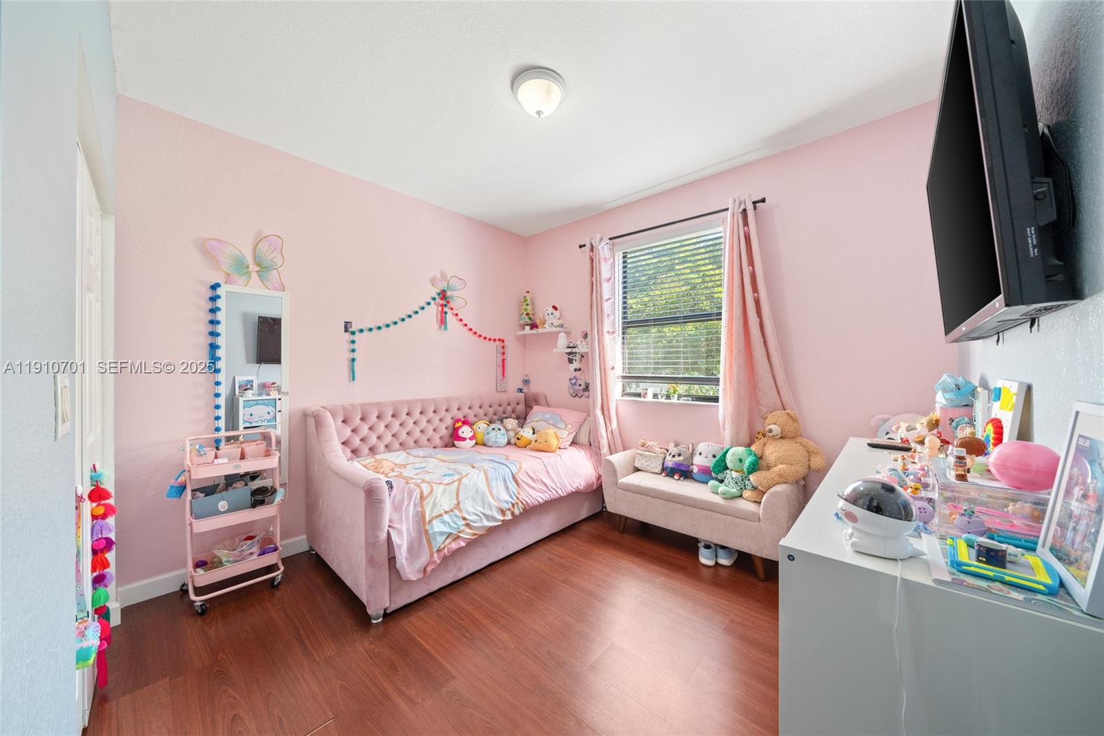 23713 Southwest 115th Avenue Homestead, FL 33032 - Photo 13 of 26 a bedroom with bed and a window