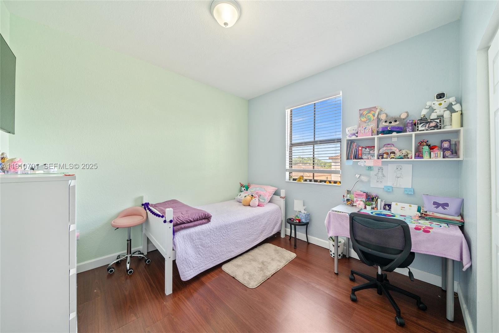 23713 Southwest 115th Avenue Homestead, FL 33032 - Photo 17 of 26 a bedroom with a workspace