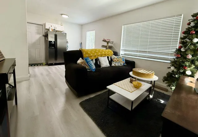 a bedroom with furniture and a potted plant