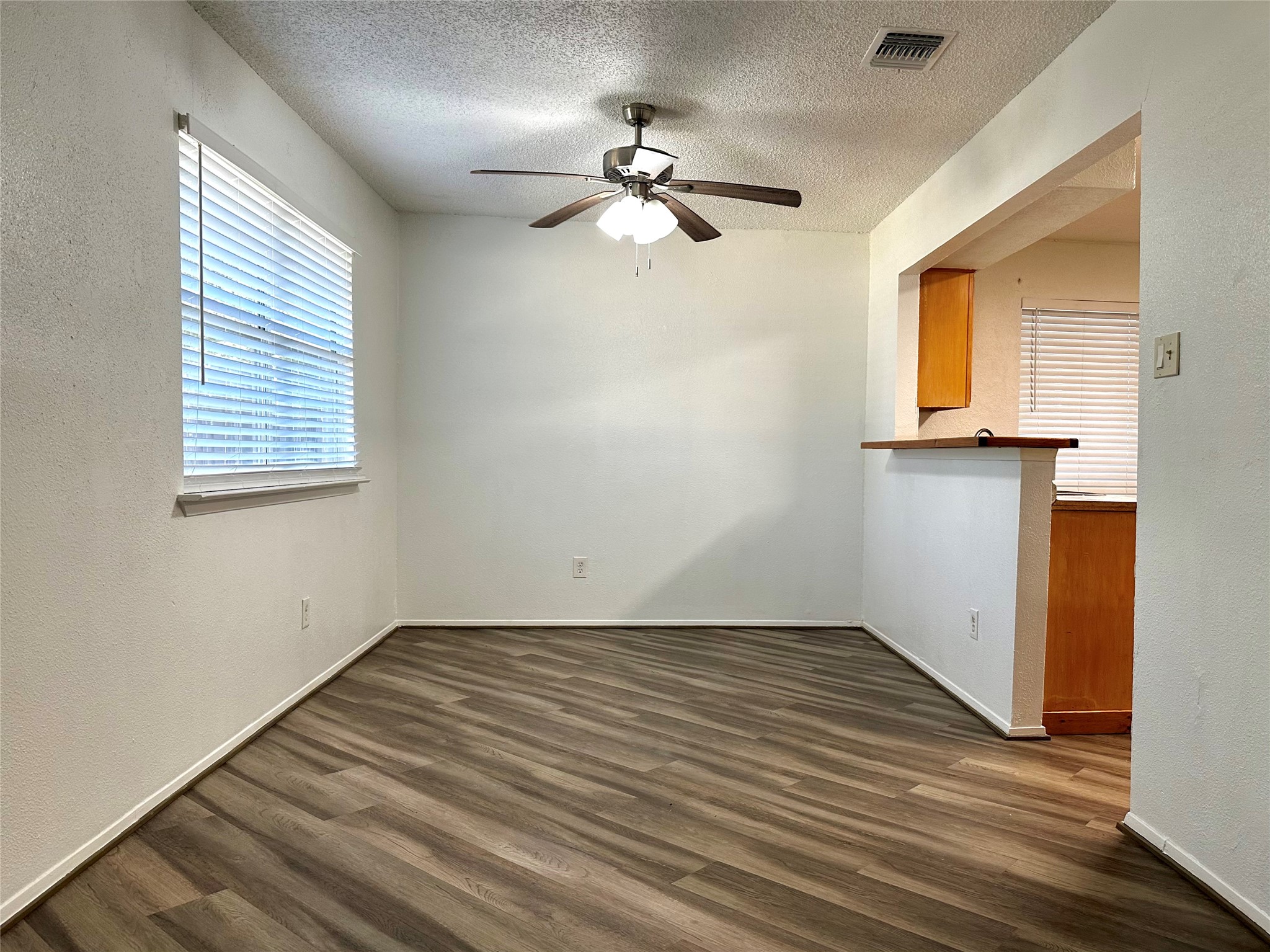 4927 Adonis Drive Spring, TX 77373 - Photo 5 of 11 wooden floor in an empty room with a window