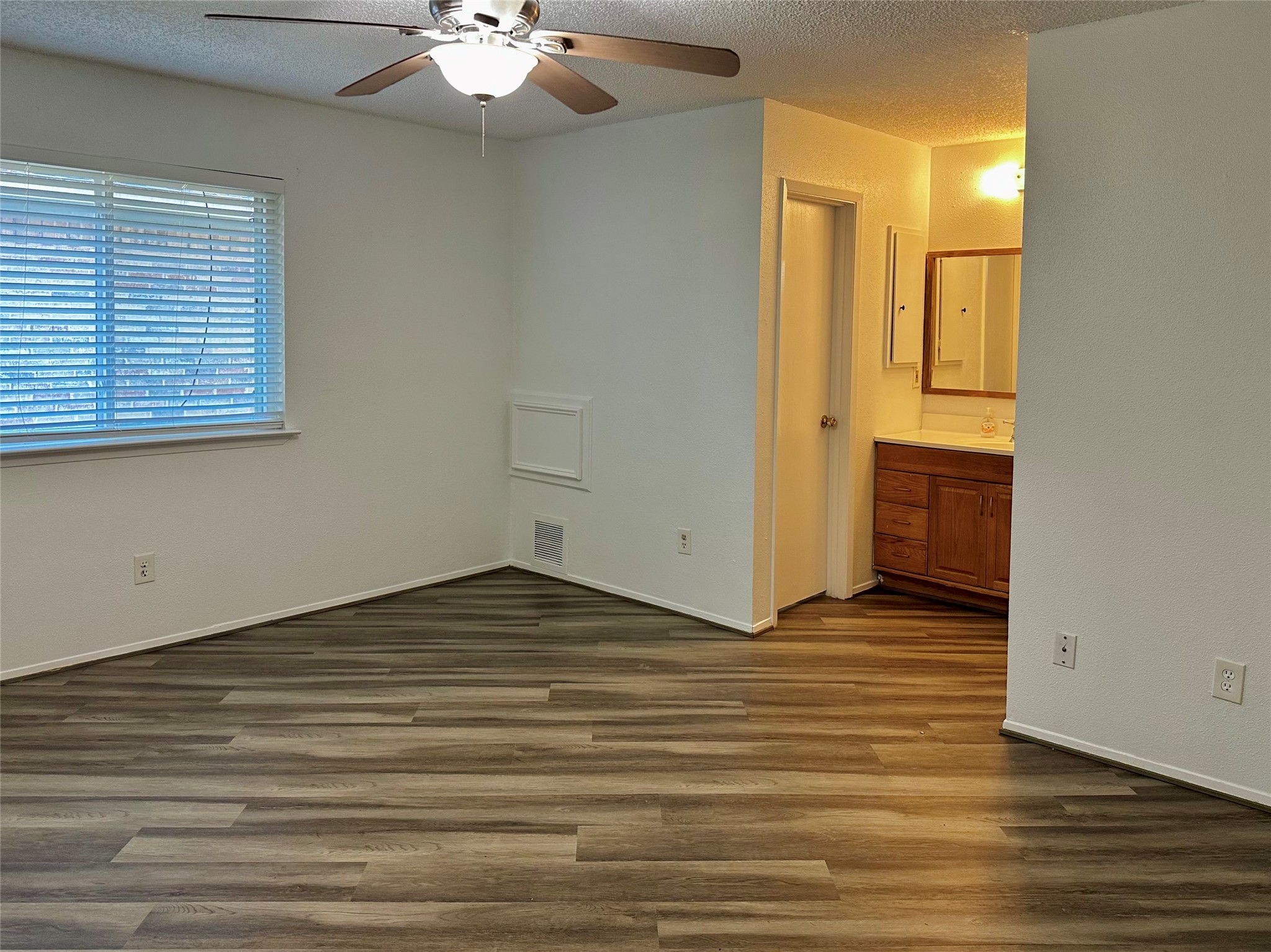 4927 Adonis Drive Spring, TX 77373 - Photo 10 of 11 a view of a room with wooden floor and chandelier