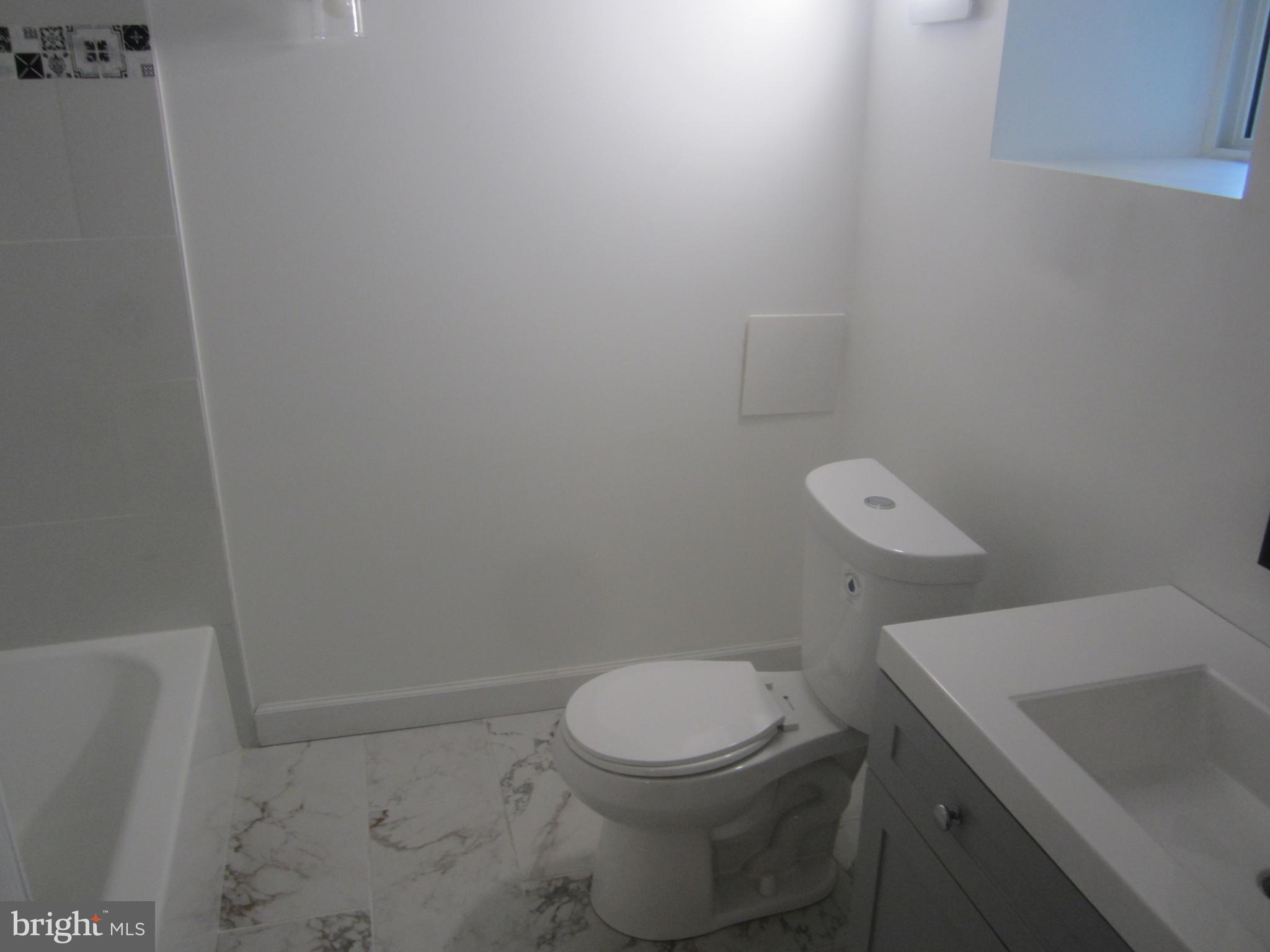 3 South Rosedale Street Baltimore, MD 21229 - Photo 25 of 29 Bathroom 2 - Toilet seat and sink