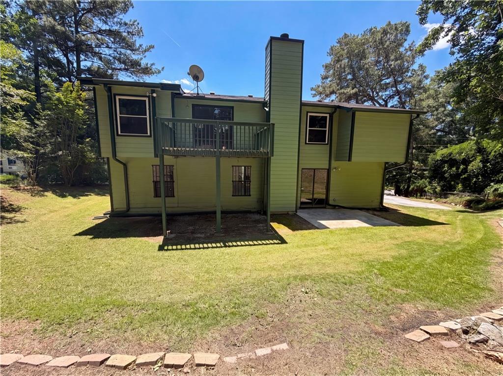 6830 Earlhurst Road Atlanta, GA 30349 - Photo 27 of 27 a view of a house with a yard
