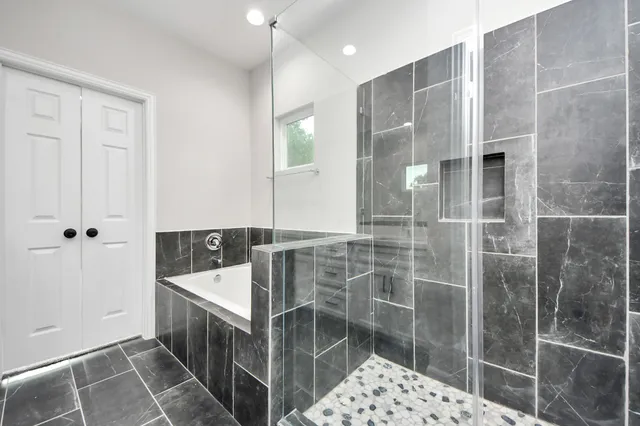 a bathroom with a double vanity sink mirror and