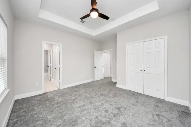 a bathroom with a sink tub vanity and a mirror