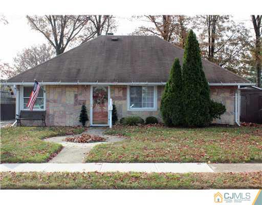 21 Brookville Road Edison, NJ 08817 - Photo 1 of 25 a front view of a house with garden
