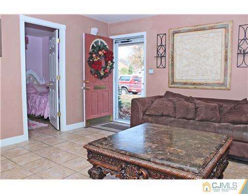 21 Brookville Road Edison, NJ 08817 - Photo 11 of 25 a living room with furniture and a window