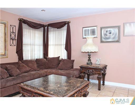 21 Brookville Road Edison, NJ 08817 - Photo 13 of 25 a living room with furniture and a window