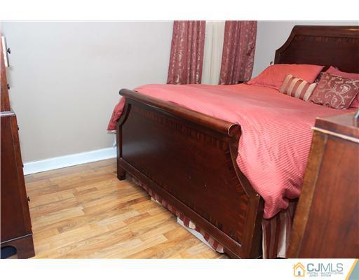 21 Brookville Road Edison, NJ 08817 - Photo 18 of 25 a bedroom with a bed and a dresser