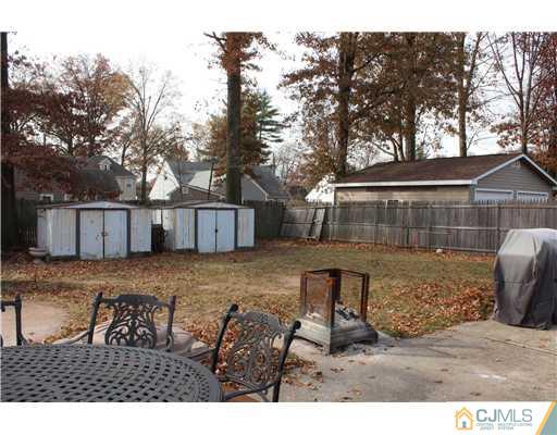21 Brookville Road Edison, NJ 08817 - Photo 25 of 25 a view of a house with a bed and wooden fence