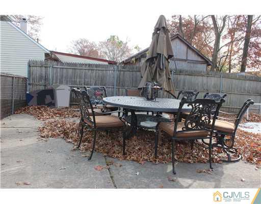 21 Brookville Road Edison, NJ 08817 - Photo 8 of 25 a view of a dinning table and chairs in the patio