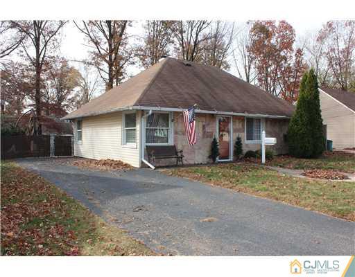 21 Brookville Road Edison, NJ 08817 - Photo 9 of 25 a view of a house with a yard and large trees