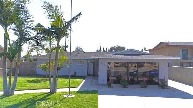 a view of a house with backyard porch and sitting area