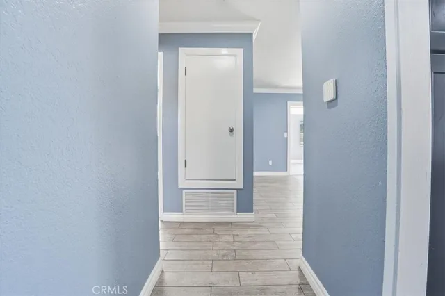 a kitchen with stainless steel appliances granite countertop a sink a stove a refrigerator and cabinets