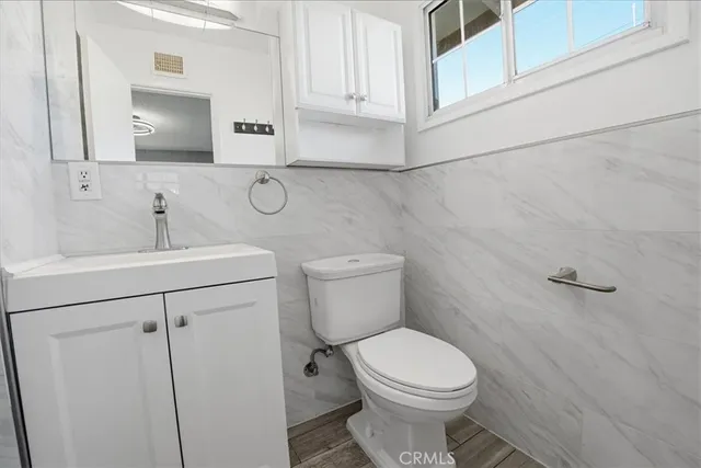a view of wooden floor and windows in a room