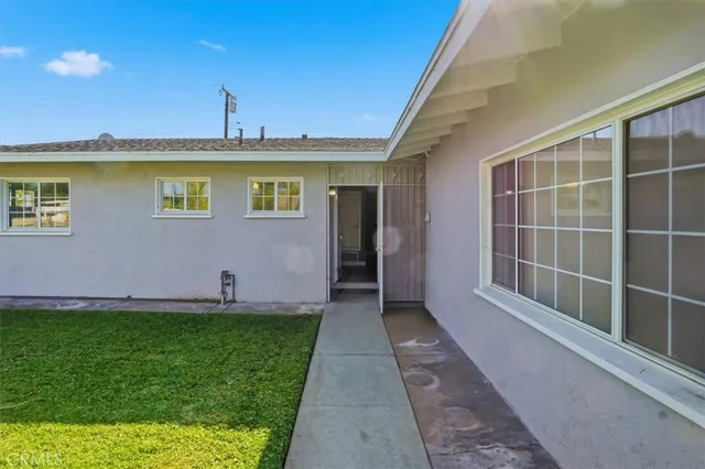 a view of front door of house with yard