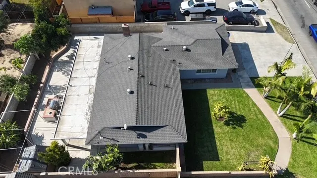 an aerial view of a residential apartment building with a yard