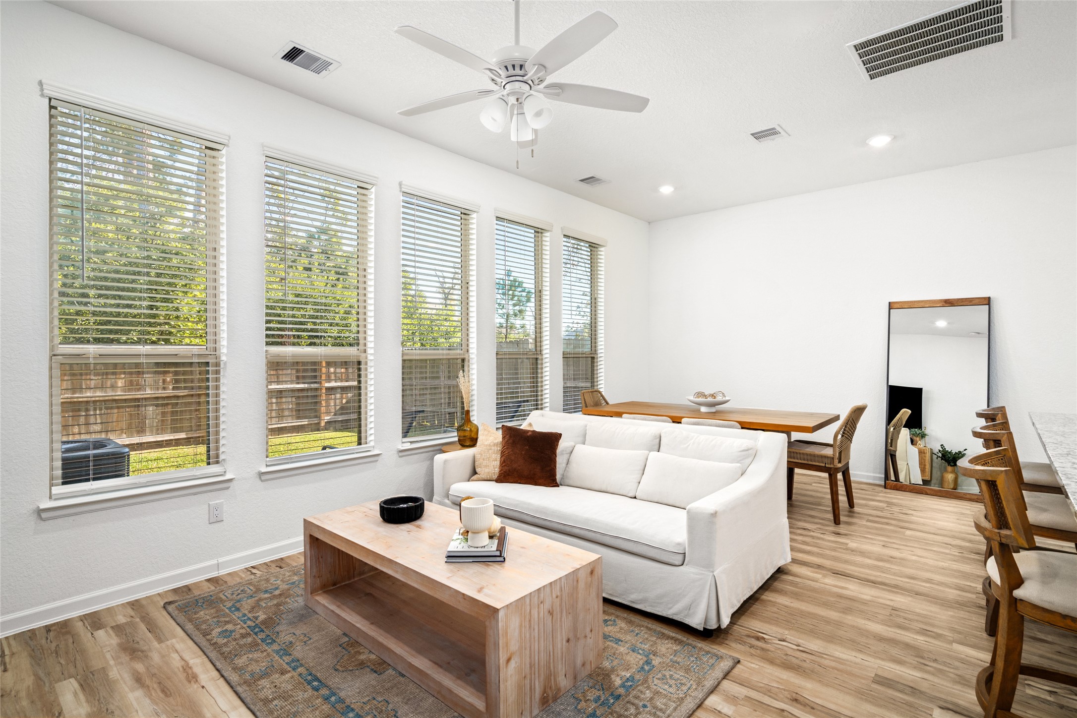 575 Dry Fork Lane Conroe, TX 77304 - Photo 2 of 34 Expansive windows frame serene views of mature trees behind the backyard.