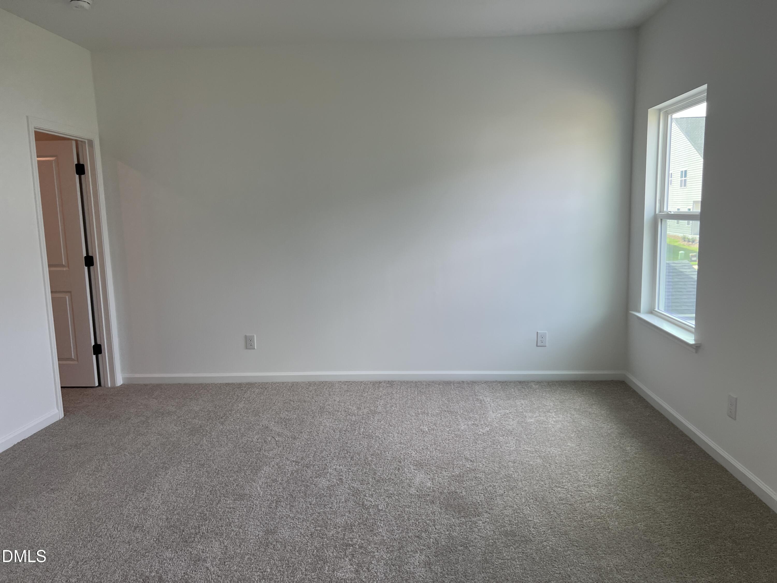 4305 Darius Lane, Unit 27 Willow Spring, NC 27592 - Photo 18 of 18 an empty room with windows and closet