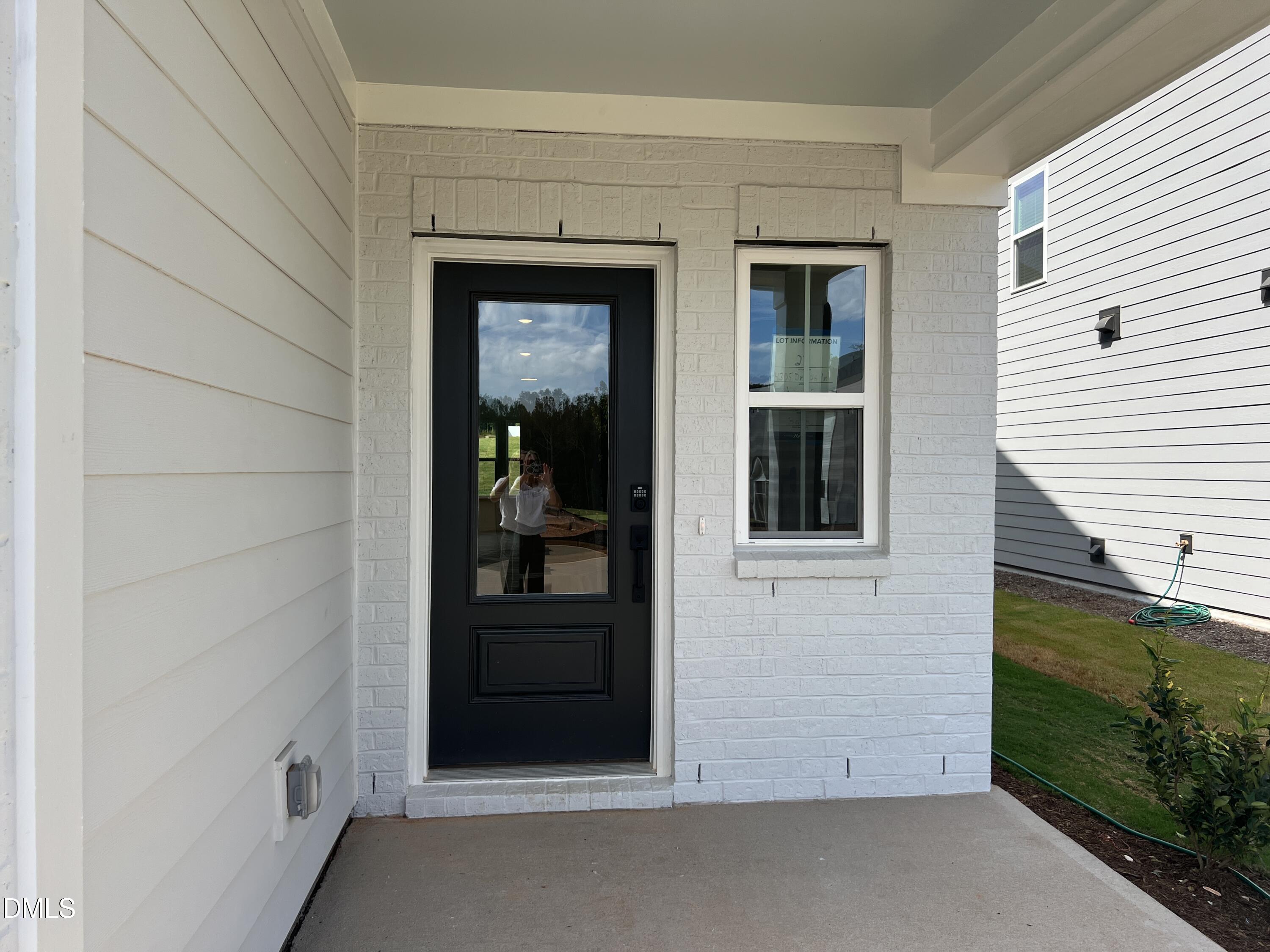 4305 Darius Lane, Unit 27 Willow Spring, NC 27592 - Photo 2 of 18 a view of front door and porch