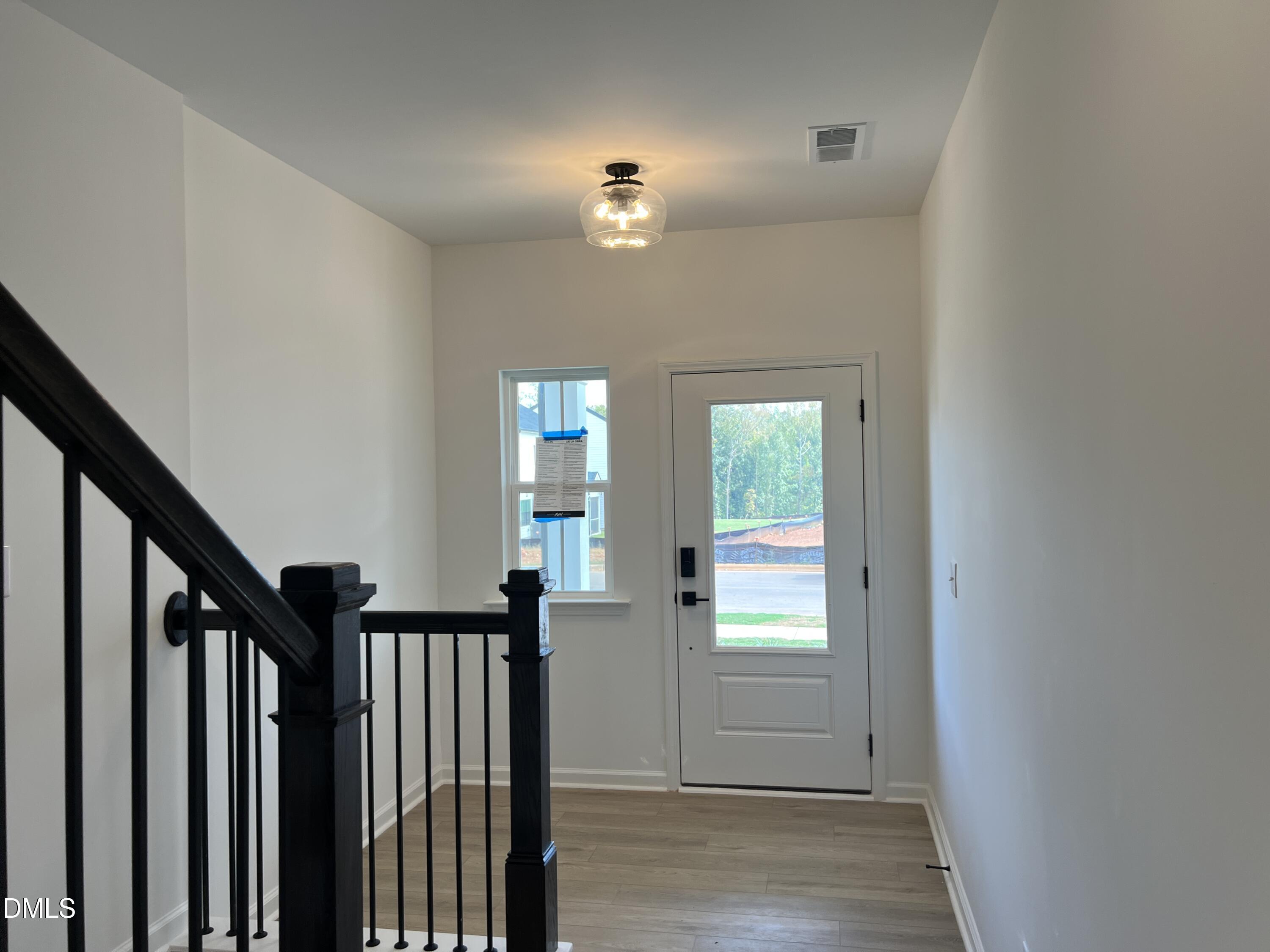 4305 Darius Lane, Unit 27 Willow Spring, NC 27592 - Photo 4 of 18 a view of a livingroom with stairs