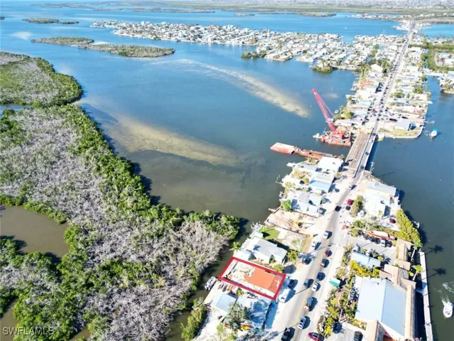 an aerial view of houses with yard