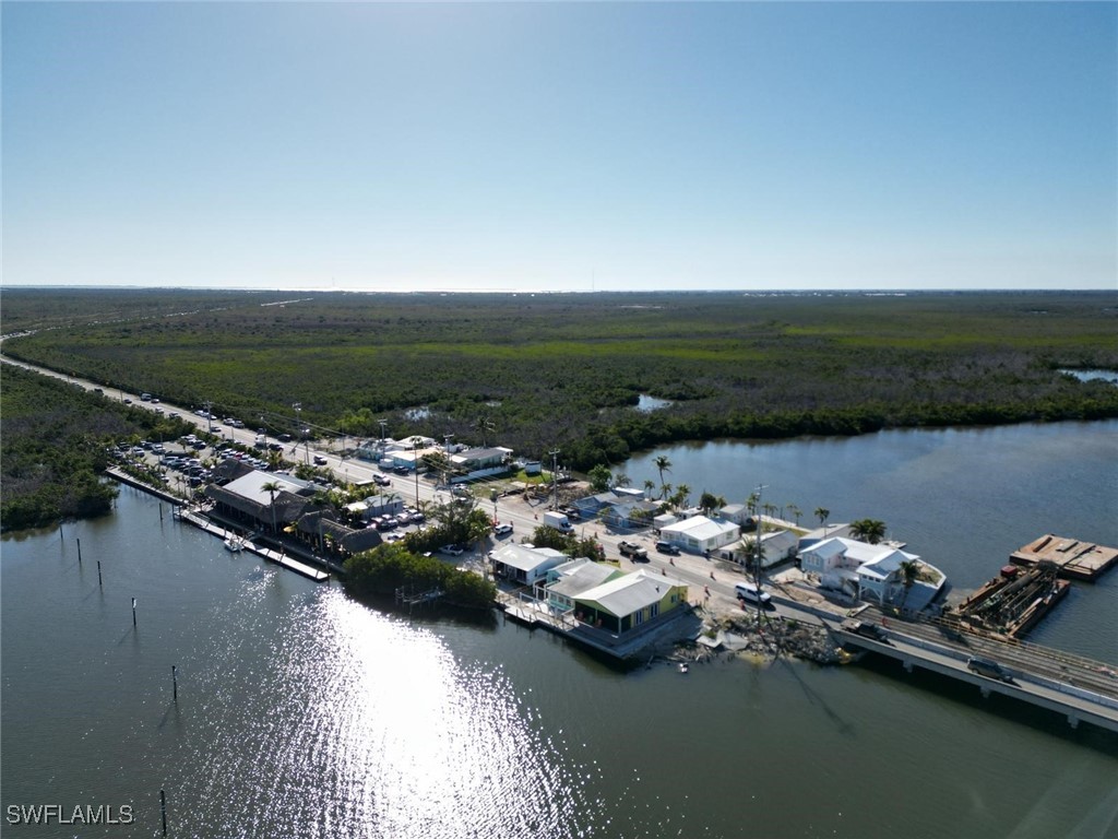 4874 Pine Island Road, Unit C St. James City, FL 33956 - Photo 13 of 14 an aerial view of a house with a lake view