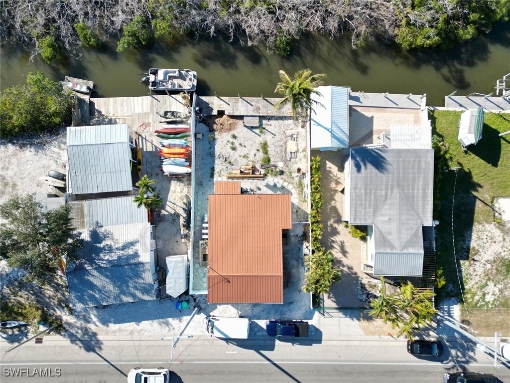 4874 Pine Island Road, Unit C St. James City, FL 33956 - Photo 14 of 14 an aerial view of houses with yard