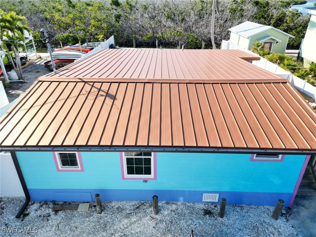4874 Pine Island Road, Unit C St. James City, FL 33956 - Photo 3 of 14 a view of a backyard with a patio