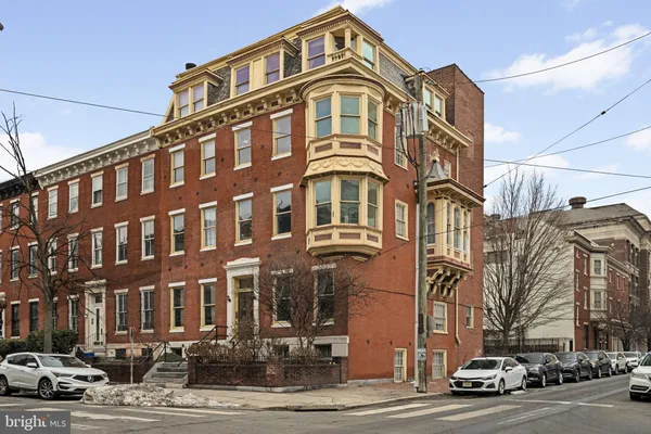 a front view of a building with street view