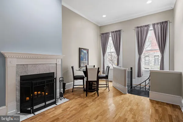 a view of a livingroom with furniture and a fireplace