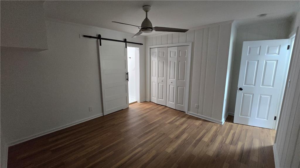 2084 Snow Road Southwest Atlanta, GA 30311 - Photo 34 of 53 a view of empty room with wooden floor