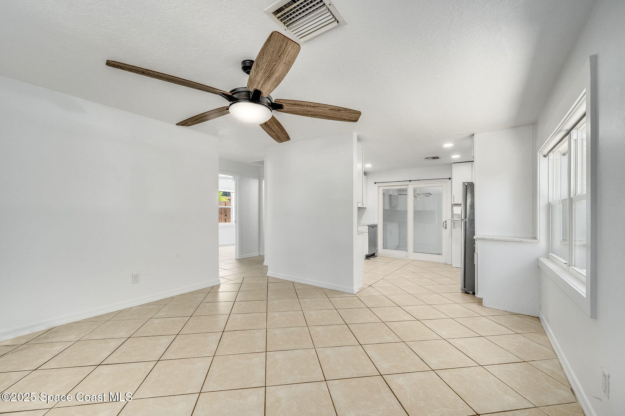 1228 East Azalea Court Melbourne, FL 32935 - Photo 7 of 18 a view of an empty room