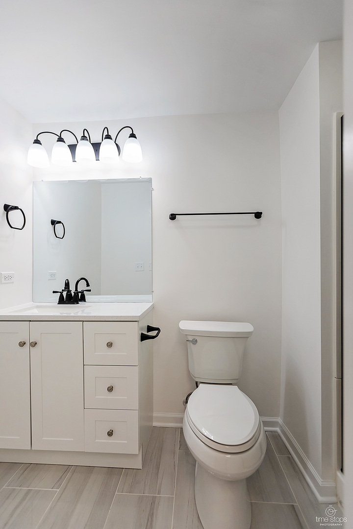 2054 Brookside Lane Aurora, IL 60502 - Photo 23 of 39 a bathroom with a sink and mirror