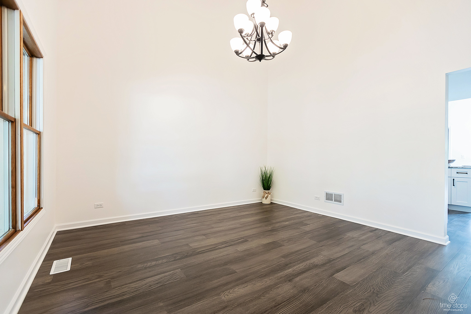 2054 Brookside Lane Aurora, IL 60502 - Photo 3 of 39 an empty room with wooden floor and windows