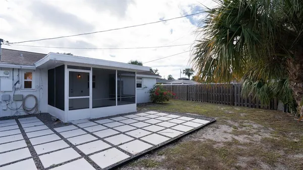 a view of a backyard of the house