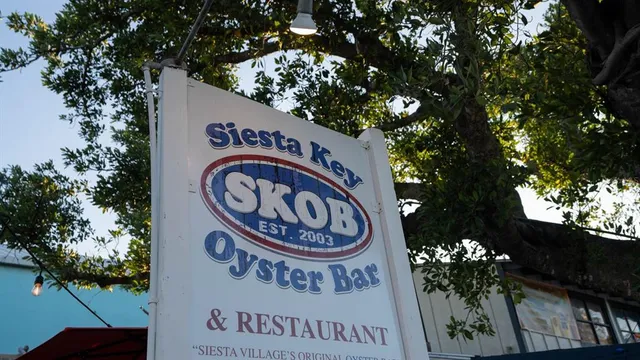 a front view of a house with a yard and a garage