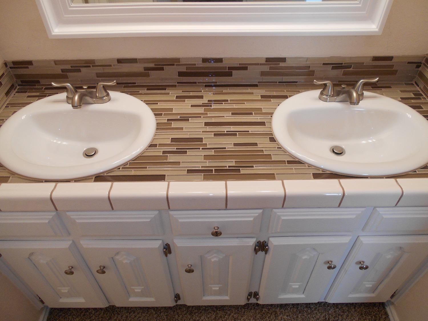 5739 Emory Street Lubbock, TX 79416 - Photo 10 of 14 a bathroom with a sink