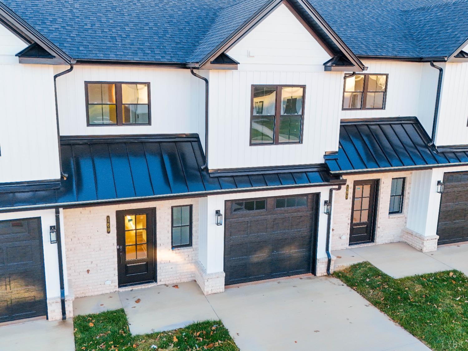 169 Luke Court Rustburg, VA 24588 - Photo 24 of 47 a front view of a house with garden