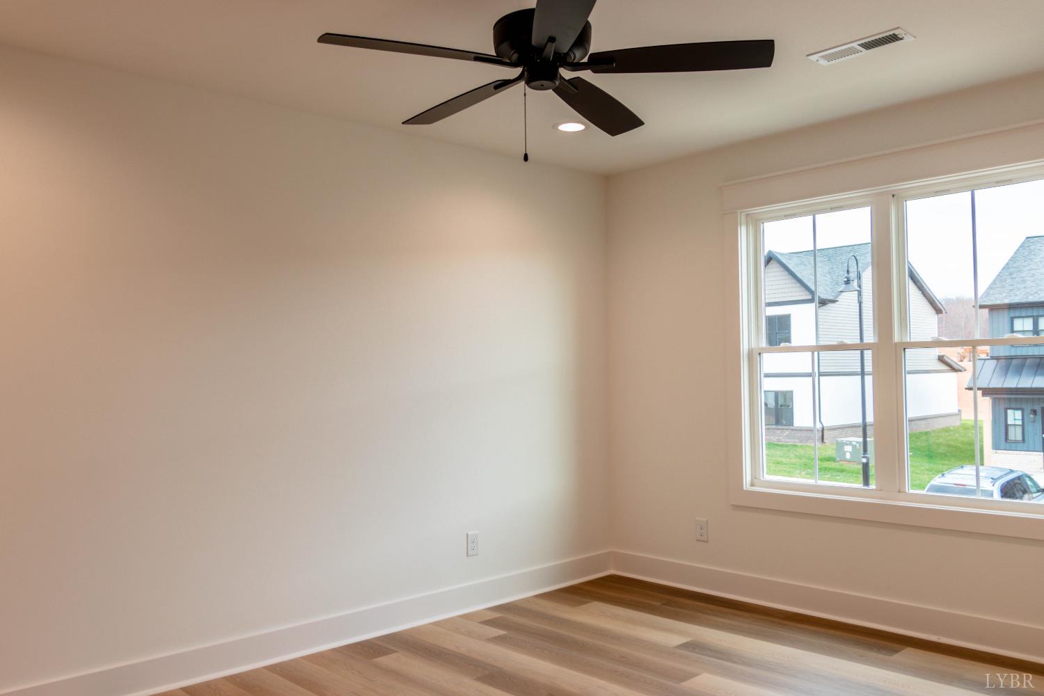169 Luke Court Rustburg, VA 24588 - Photo 30 of 47 a view of a room with wooden floor and windows